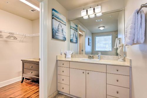 a bathroom with a sink and a mirror at Spacious Biloxi Getaway with Pools and Beach Access! in Biloxi