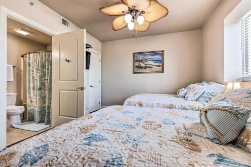 a bedroom with two beds and a ceiling fan at Spacious Biloxi Getaway with Pools and Beach Access! in Biloxi
