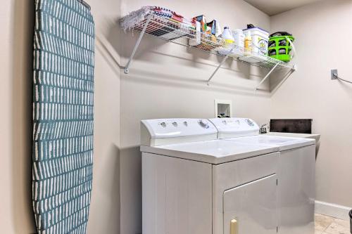 a laundry room with a washer and dryer at Spacious Biloxi Getaway with Pools and Beach Access! in Biloxi