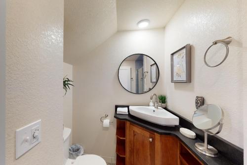 a bathroom with a sink and a mirror at The Loft Downtown in Joseph