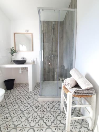 a bathroom with a shower and a toilet and a sink at Casa Maroma in Cómpeta