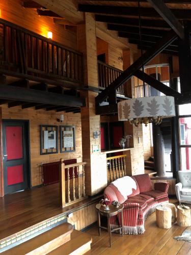 a living room with a couch and a table at La Miralejos in San Carlos de Bariloche