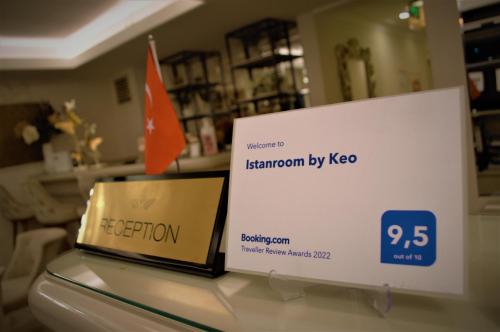 a sign sitting on a table in a store at Istanroom by Keo in Istanbul