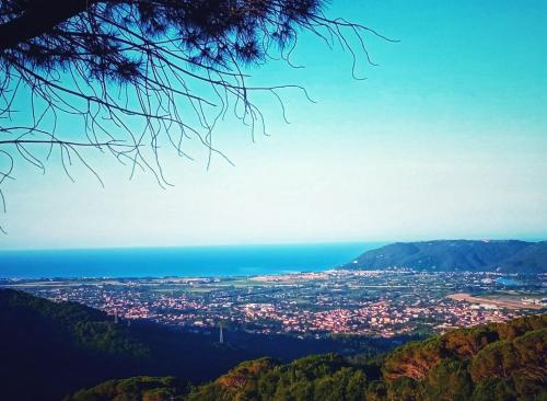 a view of a city from a mountain at LA GINESTRA B&B in Fosdinovo
