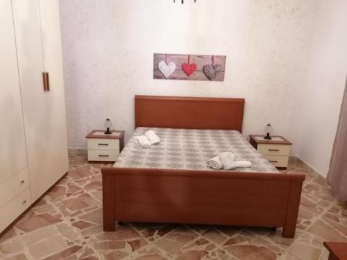 A bed or beds in a room at La Dolce Oasi