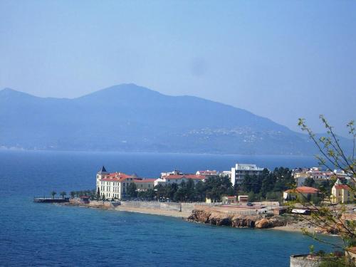 a town on the shore of a body of water at Sofia Rooms in Loutra Edipsou