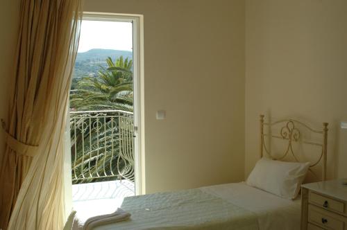 A bed or beds in a room at Irini's Villa