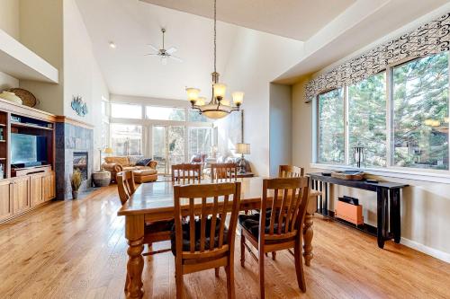 a dining room and living room with a table and chairs at Creekside Comfort in Redmond