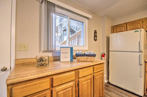 a kitchen with a counter with a refrigerator at Dock and Lake Ozark Access Pet-Friendly Retreat in Lake Ozark