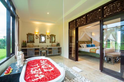 two pictures of a bathroom with a bath tub and a bedroom at Champaca Luxury Villas Ubud in Ubud
