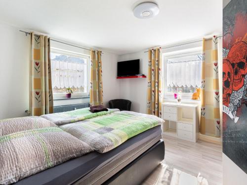 Un pat sau paturi într-o cameră la Comfortable apartment in Monschau H fen with private garden