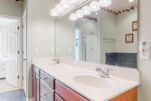 a bathroom with a sink and a mirror at Bear Trap Dunes --- 79C October Glory Ave in Ocean View