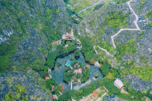 an aerial view of a lake in a forest at Mua Caves Ecolodge (Hang Mua) in Ninh Binh