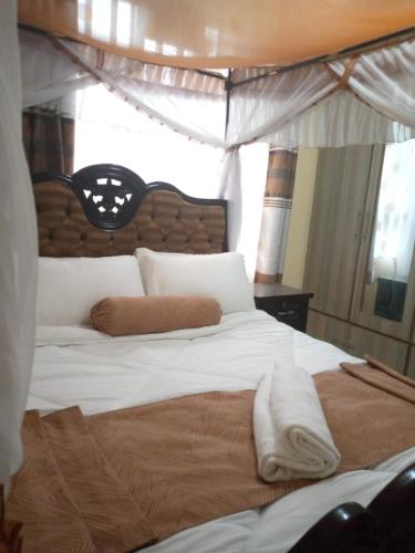 Ένα ή περισσότερα κρεβάτια σε δωμάτιο στο Levans Lounge