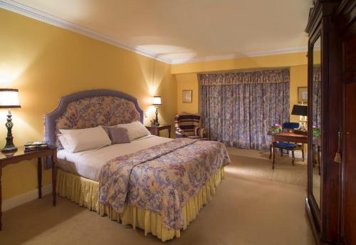 a hotel room with a bed and a window at Aherne's Townhouse Hotel and Seafood Restaurant in Youghal
