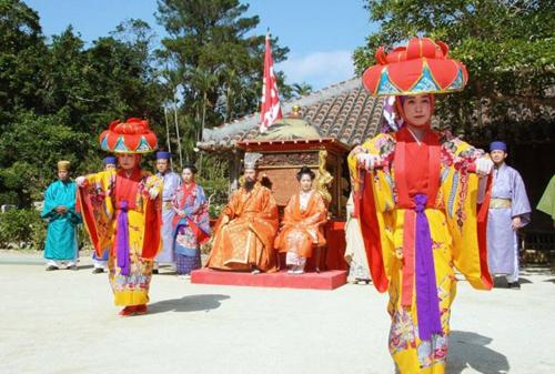 a group of people dressed up in colorful at Yomitan Ocean View Apartment 201 in Yomitan