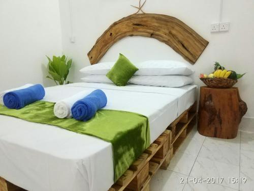 Кровать или кровати в номере Veli Thoddoo Inn