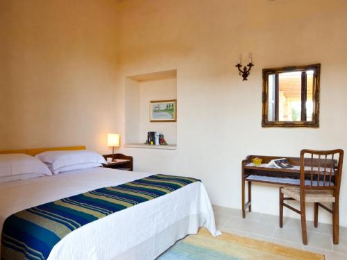Katil atau katil-katil dalam bilik di Masseria Saietti