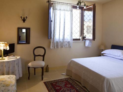 Katil atau katil-katil dalam bilik di Masseria Saietti