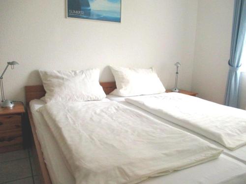 Postel nebo postele na pokoji v ubytování Am Koper Sand 28 2 - Wattwurm