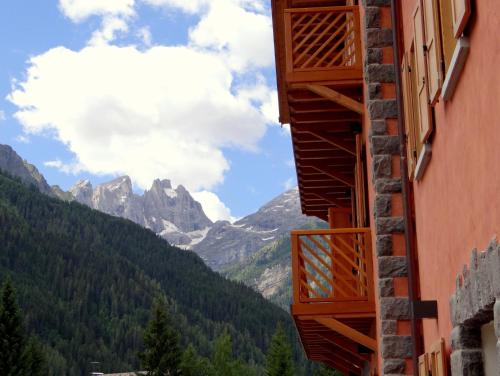 a view of the mountains from a building at Lumen in Falcade