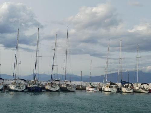 a group of boats docked in the water at Aliki Guest House in Aígio