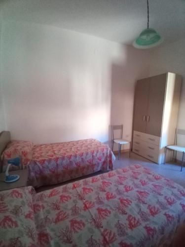 Postelja oz. postelje v sobi nastanitve B&B L'Asfodelo