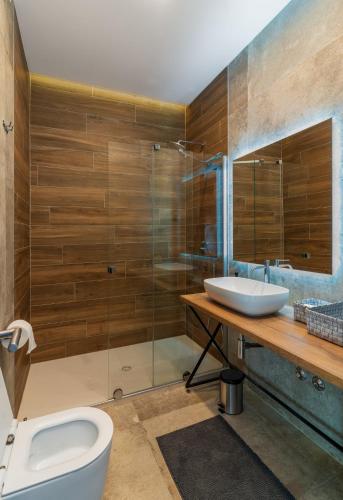 a bathroom with a toilet and a sink at Villa Blumarine in Krk