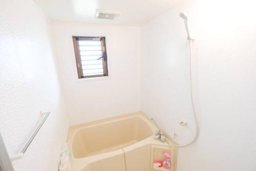 Fotografie z fotogalerie ubytování Yomitan Ocean View Apartment 401 v destinaci Jima