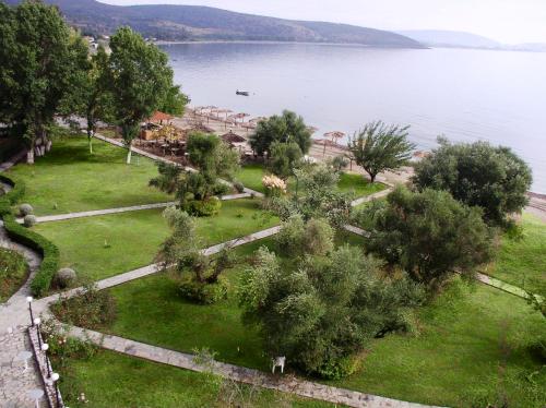 an aerial view of a park next to a body of water at Belle Helene Hotel in Vathi, Mani