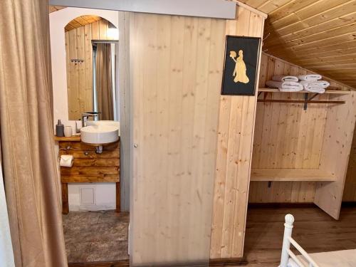 a bathroom with a sink and a counter with towels at Cabana Ana in Iloviţa