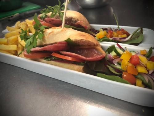 a tray of food with a sandwich and french fries at The Punchbowl Inn in Woodstock