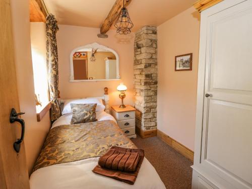 Postel nebo postele na pokoji v ubytování Ducking Well Cottage