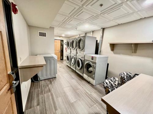 a laundry room with two washer and dryers at Staybridge Suites Detroit-Novi by IHG in Novi