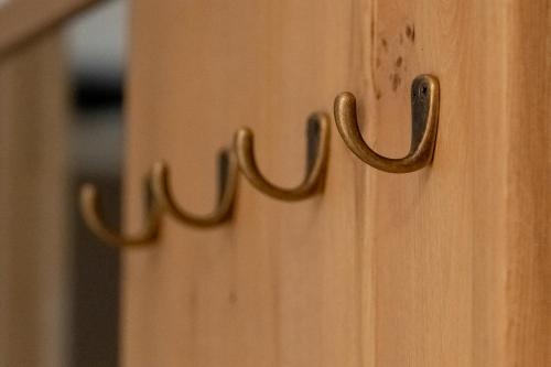 a close up of a wooden door with two handles at Hantang Inn Hostel Xi'an in Xi'an