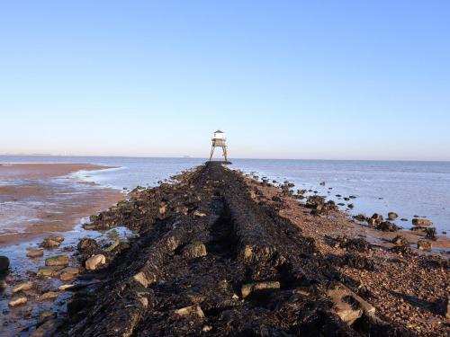 a cross on the shore of the ocean at Flat 19 By The Beach in Harwich