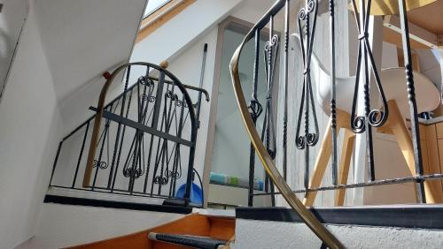 a staircase with a bunch of skis on the railing at Seevilla Wietjes Whg 7 in Baltrum