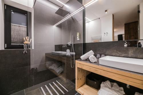 a bathroom with a sink and a mirror at Chalet Ortles in San Valentino alla Muta