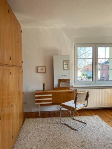 a room with a desk and a chair and a window at Westfälischer Hof - 2nd floor 