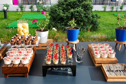 a table filled with cupcakes and other desserts on tables at Hyatt Regency Bishkek in Bishkek