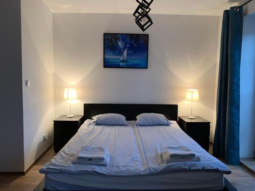 Ένα ή περισσότερα κρεβάτια σε δωμάτιο στο Apartamenty Żeglarskie w Vęgorii