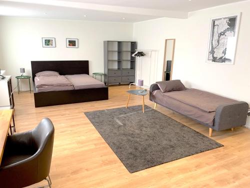 Apartment - Modern, gemütlich, eigener Parkplatzにあるベッド