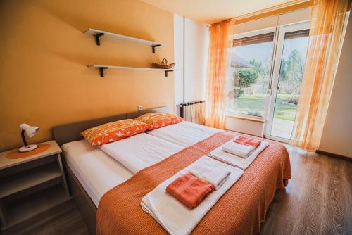 A bed or beds in a room at Apartma Rombon Brdo with Free Onsite Parking