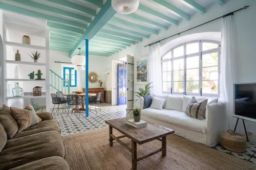 a living room with a couch and a table at CA'N QUINN in Deia