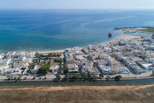 an aerial view of a resort next to the ocean at LI PALI Hotel & Restaurant in Torre Pali 