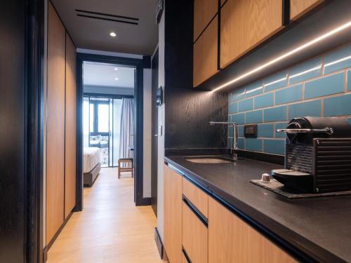 a kitchen with a counter top and a sink at 3 Pines Design Living in Heraklio Town