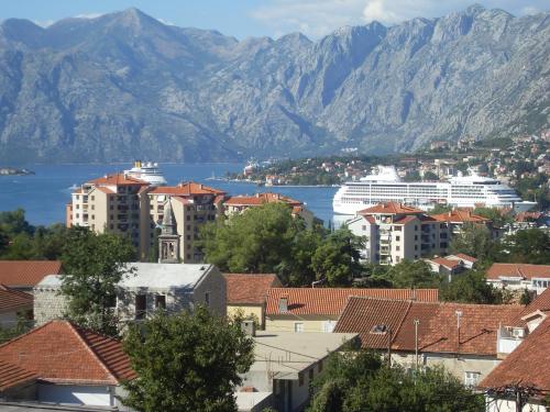 a large building with a view of the ocean at Guest House Sandra in Kotor