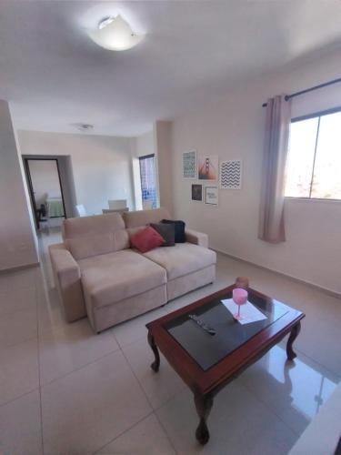 a living room with a couch and a coffee table at Park Towers in Natal