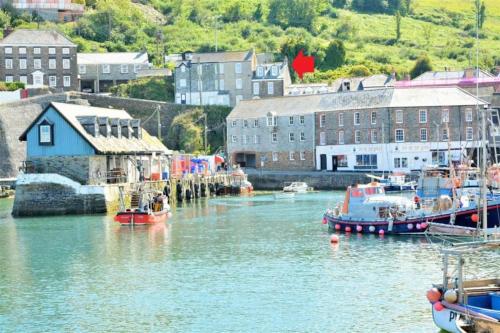 a group of boats are docked in a harbor at Fabulous 2 Bed Cottage - Outstanding Sea Views in Mevagissey