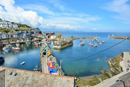 a view of a harbor with boats in the water at Fabulous 2 Bed Cottage - Outstanding Sea Views in Mevagissey